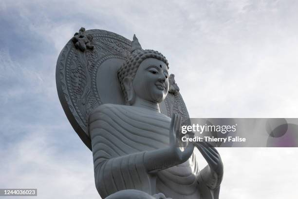 Statue of a sitting Buddha lays in the twin Buddhist temples of Wat Jong Kham and Jong Klang in downtown Mae Hong Son. They date from the early 19th...