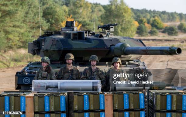 The crew of a main battle tank Leopard 2 with its munitions waiting for Chancellor Olaf Scholz during a visit at the Bundeswehr army training center...