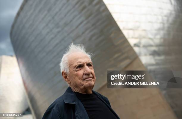 Architect Frank Gehry poses in front of the Guggenheim Bilbao Museum during its 25th anniversary celebrations in the Spanish Basque city of Bilbao on...