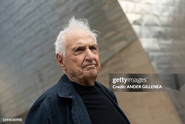 Architect Frank Gehry poses in front of the Guggenheim Bilbao Museum during its 25th anniversary celebrations in the Spanish Basque city of Bilbao on...