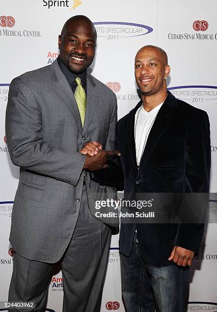 Former NFL player Marcellus Wiley and Detroit Lions football player Dennis Northcutt arrive at the 2011 Cedars Sinai Sports Spectacular at Hyatt...