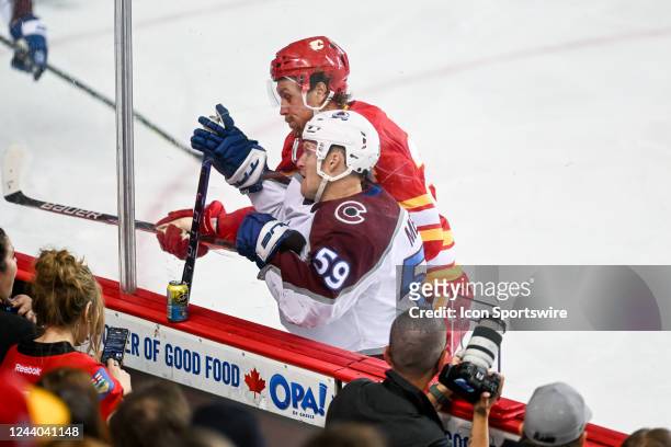 Calgary Flames Right Wing Brett Ritchie hits Colorado Avalanche Right Wing Ben Meyers into the glass during the second period of an NHL game between...
