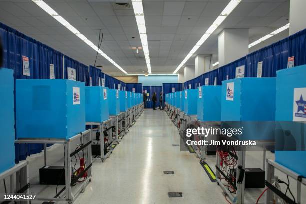 Voting booths are seen as Former first lady Michelle Obama and former U.S. President Barack Obama cast their votes at an early voting venue on...