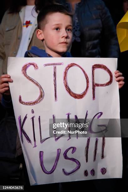 Young boy holds a sign during a protest in Warsaw, Poland on 17 October, 2022. Several hundred people gathered in front of the Iranian embassy to...