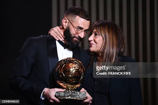 Real Madrid's French forward Karim Benzema receives the Ballon d'Or award next to his mother Malika Benzema during the 2022 Ballon d'Or France...