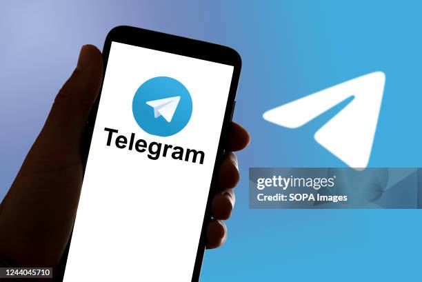 In this photo illustration, the online chat and communication app Signal Telegram logo seen displayed on a mobile phone and on a laptop.