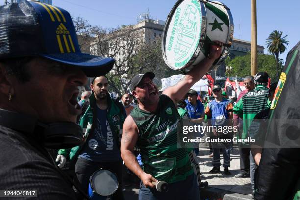 Supporter of Hugo Moyano leader of Camioneros Union shouts slogans and holds a drum during a demonstration for the Peronist Loyalty day at Plaza de...