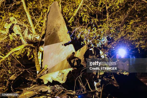 The wreckage of a Sukhoi Su-34 military jet lie at the crash site in the courtyard of a residential area in the town of Yeysk in southwestern Russia...