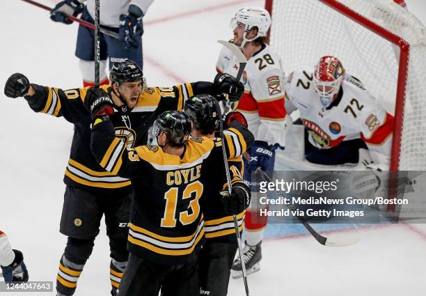 October 17: A.J. Greer of the Boston Bruins screams out in celebration with Charlie Coyle and Trent Frederic after scoring against Sergei Bobrovsky...