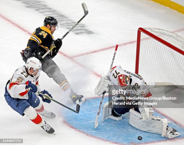 October 17: Jake DeBrusk of the Boston Bruins tries to put the puck into the net past Carter Verhaeghe and Sergei Bobrovsky of the Florida Panthers...