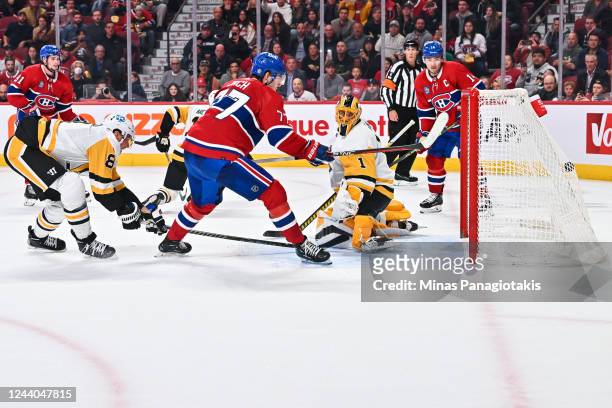 Kirby Dach of the Montreal Canadiens scores on goaltender Casey DeSmith of the Pittsburgh Penguins in overtime at Centre Bell on October 17, 2022 in...