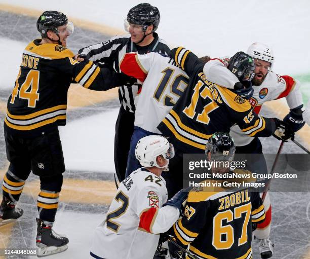 October 17: Dan Renouf of the Boston Bruins moves towards Matthew Tkachuk of the Florida Panthers while Nick Foligno and Radko Gudas start to fight...