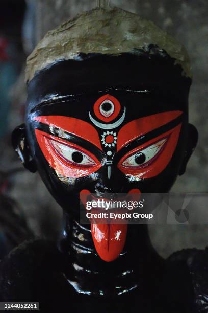Closeup of unfinished clay idol of goddess Kali that is being sculpted ahead of the annual one day Kali puja, that scheduled on 24 October , 2022....