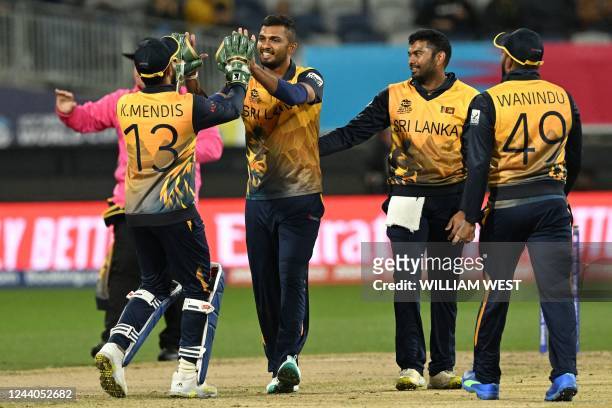 Sri Lanka's Dasun Shanaka celebrates his wicket of UAE's Basil Hameed with teammates during the ICC mens Twenty20 World Cup 2022 cricket match...