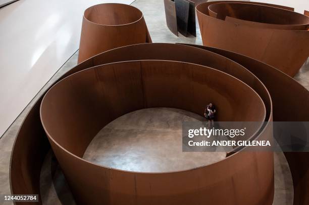 Visitors look at the artwork "The Matter of Time" by US artist Richard Serra during the presentation of the "25 Years of the Museum Collection"...