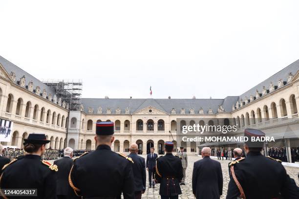 French President Emmanuel Macron attends a tribute to veterans of the Algerian war, at the Invalides in Paris, on October 18 as part of the...