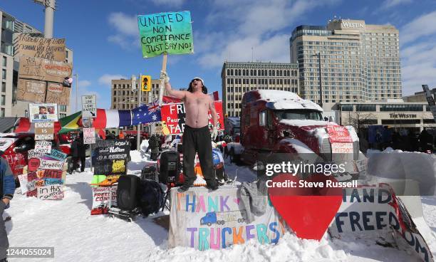 Protester makes his stand on Wellington Street as police begin to remove the "Freedom Convoy" in Ottawa from in front of Parliament Hill and...