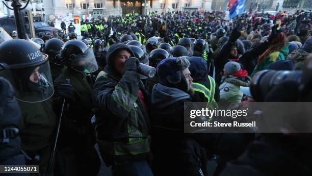 Police move protesters from Rideau and Sussex Streets. The "Freedom Convoy" in Ottawa occupied Wellington Street in front of Parliament Hill and...