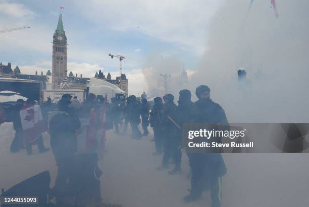 Police line up opposite protesters on Wellington Street in front of Parliament Hill. The "Freedom Convoy" in Ottawa were moved from in front of...