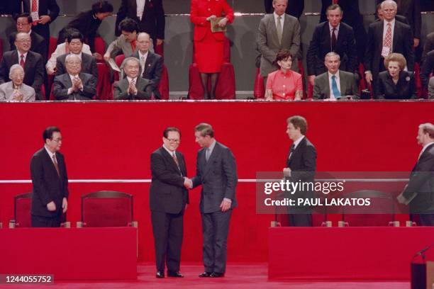 Chinese President Jiang Zemin shakes hands with Prince Charles during the handover ceremony on July 1st, 1997 in Hong Kong. Hong Kong returned to...