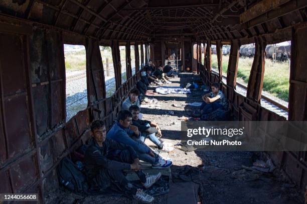 Male asylum seekers as seen in abandoned old train carriages near Thessaloniki city on their way to follow the Balkan Route towards Northern...