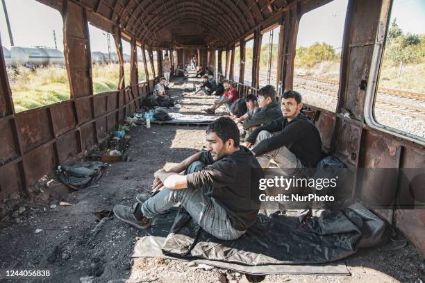 Male asylum seekers as seen in abandoned old train carriages near Thessaloniki city on their way to follow the Balkan Route towards Northern...