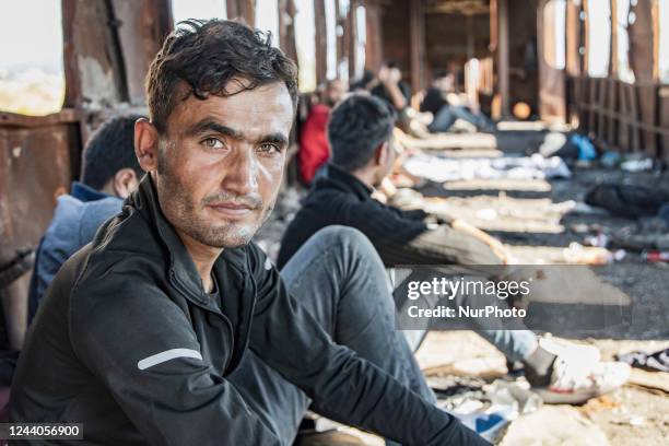 Male asylum seekers as seen in abandoned old train carriages near Thessaloniki city on their way to follow the Balkan Route towards Northern...