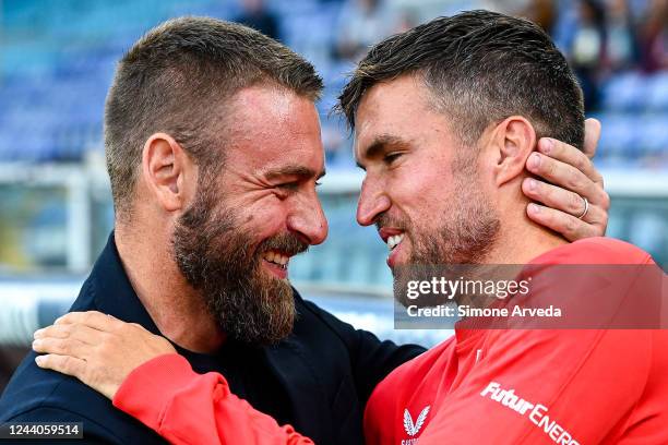 Daniele De Rossi head coach of Spal greets Kevin Strootman of Genoa prior to kick-off in the Coppa Italia match between Genoa CFC and Spal at Stadio...