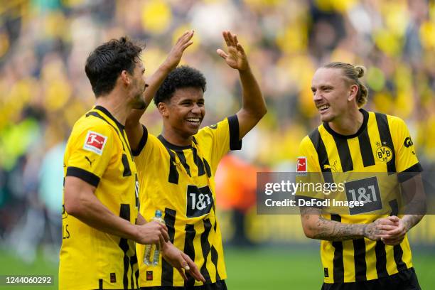 Mats Hummels of Borussia Dortmund, Karim Adeyemi of Borussia Dortmund and Marius Wolf of Borussia Dortmund celebrate after winning after the...