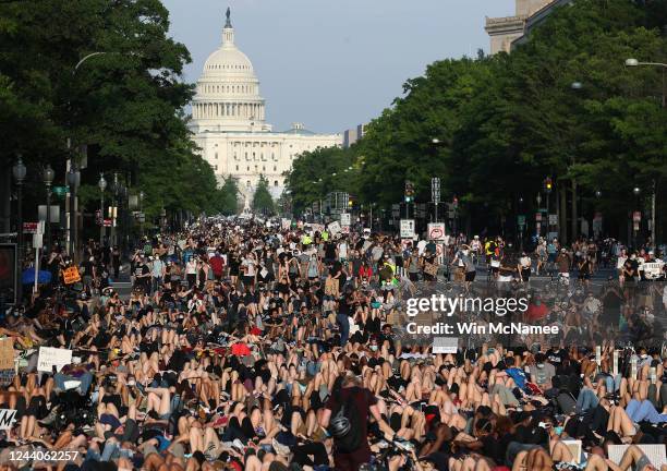 Demonstrators lay down on Pennsylvania Avenue during a peaceful protest against police brutality and the death of George Floyd, on June 3, 2020 in...