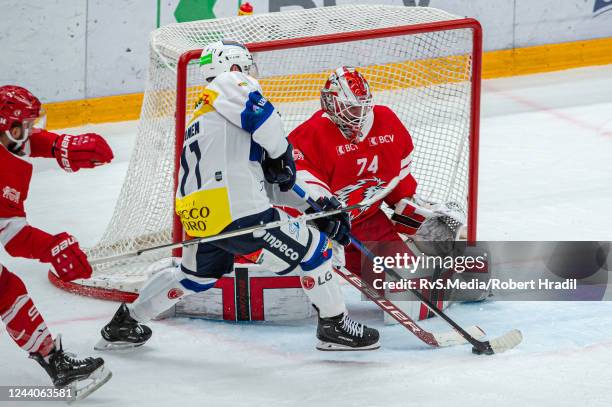 Jesse Virtanen of HC Ambri-Piotta tries to score against Goalie Ivars Punnenovs of Lausanne HC during the National League match between Lausanne HC...