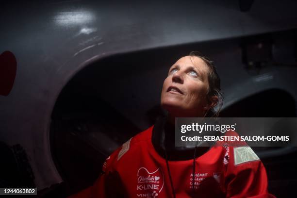 British skipper Samantha Davies poses as she sails aboard her Imoca monohull « Initiatives Coeur » off Lorient, western France, on October 18 in...