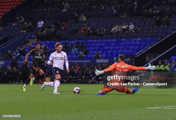 Bolton Wanderers' Kieran Sadlier takes the ball around Leeds United U21 Joel Robels and scores to make it 3-0 in the 89th minute during the Papa...