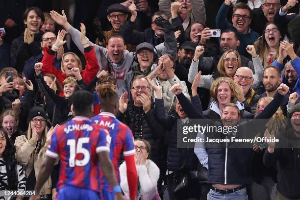 Wilfried Zaha of Crystal Palace celebrates after scoring their second goal with the fans during the Premier League match between Crystal Palace and...