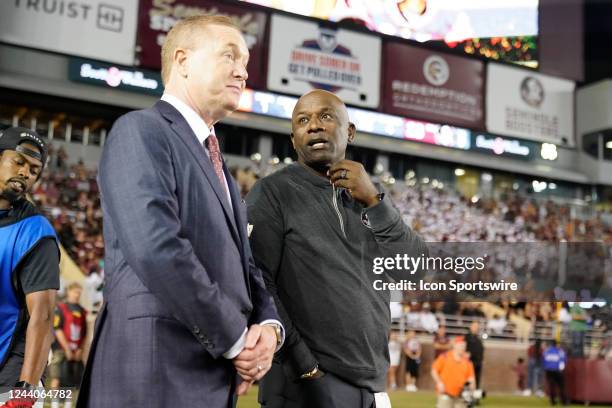 Florida State Seminoles Vice President and Athletic Director Michael Alford and former and College Football Hall of Famer Terrell Buckley talk during...
