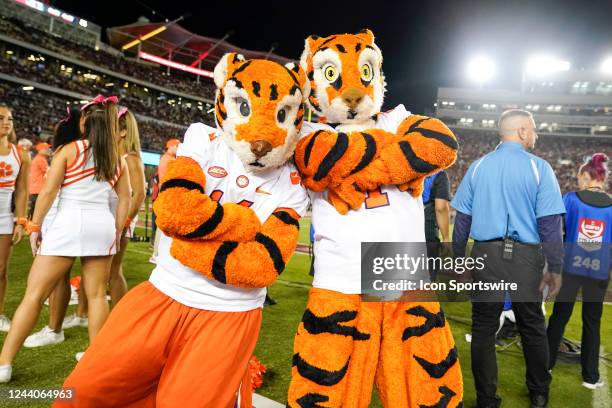 Clemson Tiger and Tiger Cub mascot pose during the Clemson Tigers game against the Florida State Seminoles on October 15 at Doak Campbell Stadium in...