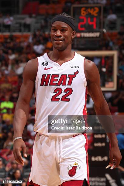 Jimmy Butler of the Miami Heat smiles during a preseason game against the New Orleans Pelicans on October 12, 2022 at FTX Arena in Miami, Florida....