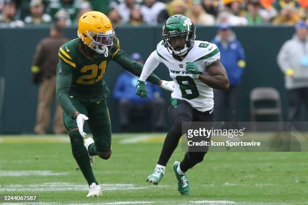 Green Bay Packers cornerback Eric Stokes tries to slow down New York Jets wide receiver Elijah Moore during a game between the Green Bay Packers and...