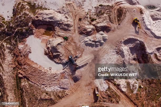 This aerial view shows the Moonstone mine in Doringbaai on September 22, 2022. - With pink flamingos, white beaches and blue ocean waters, a stretch...