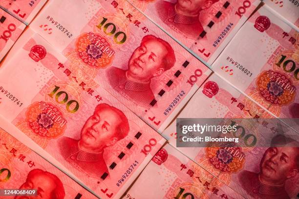 Chinese one-hundred yuan banknotes arranged in Hong Kong, China, on Tuesday, Oct. 18, 2022. China's central bank halted its cash withdrawal via...