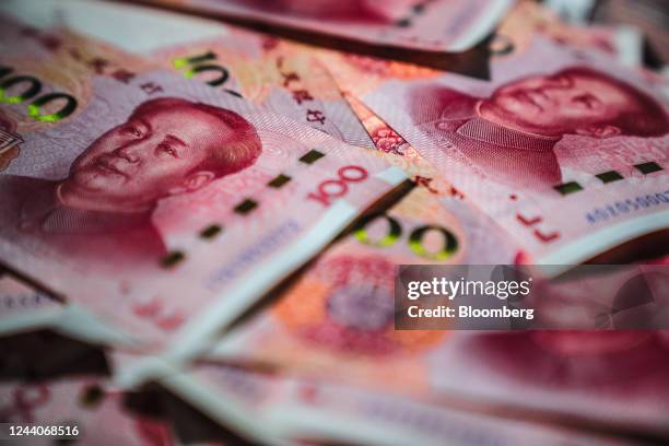 Chinese one-hundred yuan banknotes arranged in Hong Kong, China, on Tuesday, Oct. 18, 2022. China's central bank halted its cash withdrawal via...