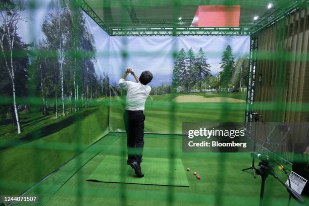 An attendee tries out the AIGIA system using Fujitsu Ltd.'s 3D sensing technology at the Combined Exhibition of Advanced Technologies in Chiba,...