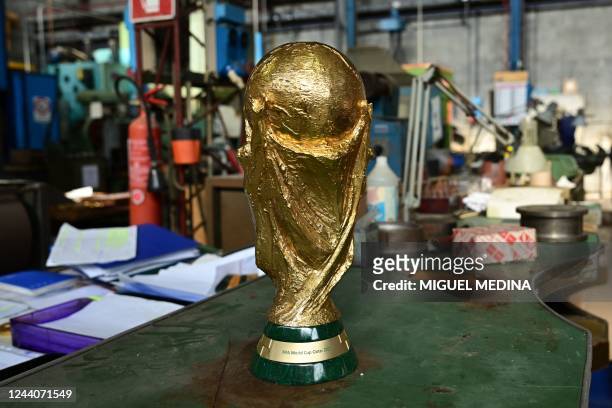 An almost finished replica of the FIFA World Cup trophy, for the FIFA World Cup Qatar 2022, is pictured at the Italian trophy and medal manufacturer...