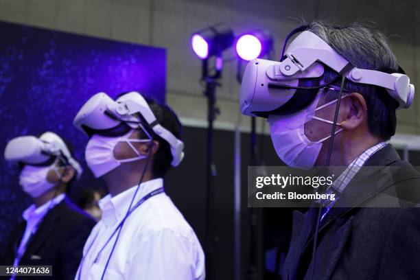 Attendees wear virtual reality headsets to experience virtual content from the International Space Station in the Bascule Inc. And the Japan...