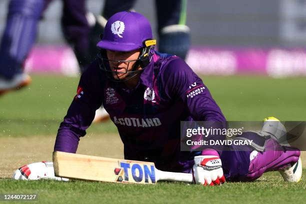 Scotland's Captain Richard Berrington gains his ground against a run out attempt during the ICC mens Twenty20 World Cup 2022 cricket match between...