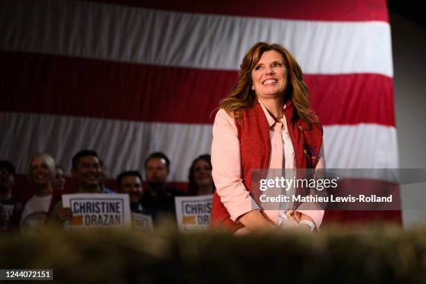 Republican gubernatorial candidate Christine Drazan reacts as Virginia Gov. Glenn Youngkin speaks to her constituents during a rally on October 18,...