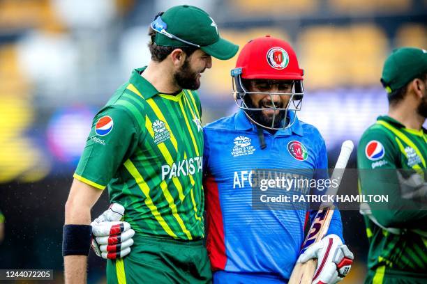Pakistan's Shaheen Shah Afridi embraces Usman Ghani as they both walk off together during the ICC men's Twenty20 World Cup 2022 cricket warm-up match...