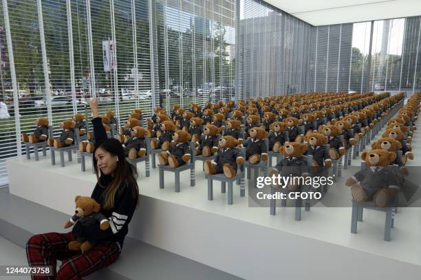 Little bears" dressed in suits sit neatly in a hut outside a Rui Ou department store in Shanghai, China, on Oct 19, 2022. It's a limited-time...