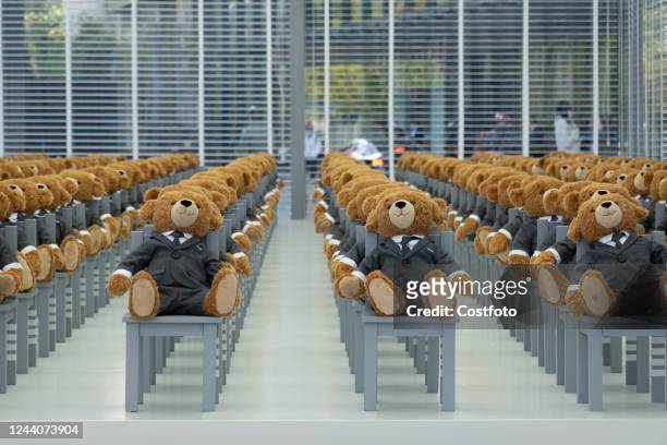 Little bears" dressed in suits sit neatly in a hut outside a Rui Ou department store in Shanghai, China, on Oct 19, 2022. It's a limited-time...