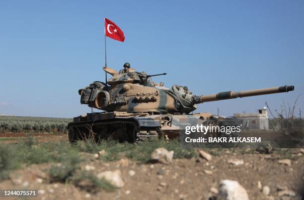 Turkish troops are pictured on the outskirts of the Syrian town of Afrin on October 19, 2022 as the Hayat Tahrir al-Sham jihadist group advances...